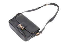 A vintage Celine black leather handbag.