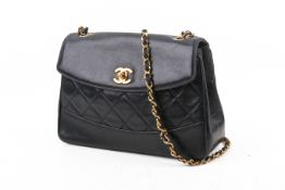 A vintage Chanel 'Diana' style navy blue flap handbag.