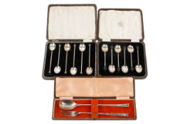 Three vintage cased sets of silver flatware.