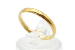 A small 22ct gold wedding band ring. Band width 2mm, size I, weight 2.3g.
