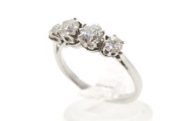 A four stone diamond ring. Set with old brilliant cut diamonds of 0.