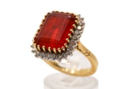 A tested 18ct gold and opal dress ring. Set centrally with an emerald cut fire opal of 5.