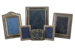 Six assorted silver fronted photo frames. Various designs, decorations and hallmarks, largest H22cm.