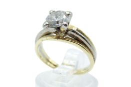 An 18ct gold diamond solitaire ring. One round brilliant cut diamond of 1.