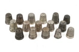 Sixteen vintage silver and white metal thimbles.