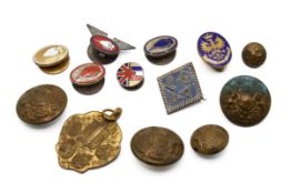 A small group of military related buttons.