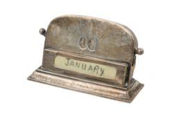 An early 20th century silver mounted desk calendar.