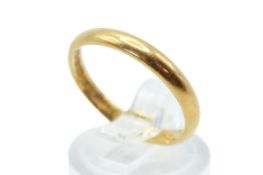 A 22ct gold wedding band. Undecorated, band width 2.5mm, size P 1/2, weight 3.3g.