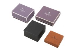 A group of four designer retail outer boxes.