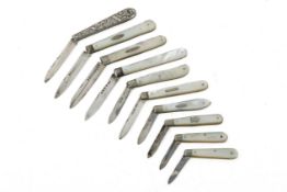 Ten vintage silver and mother-of-pearl fruit knives.