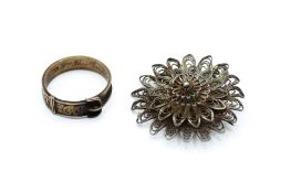 A Victorian child's mourning ring and a silver filigree brooch.
