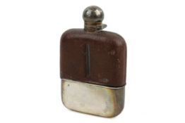 An early 20th century silver mounted hip flask.