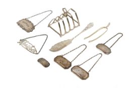 A small group of silver table items.