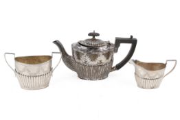 A late Victorian small three-piece silver tea set.