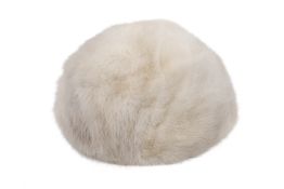 A vintage Harrods white fur hat.