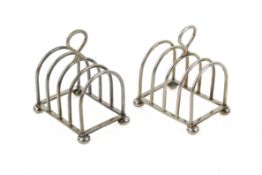 A pair of 1930s small silver toast racks.