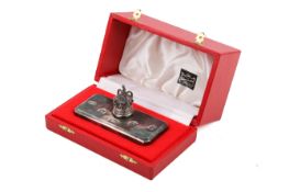 A 1977 jubilee silver paperweight.