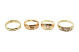 Four 18ct gold rings.