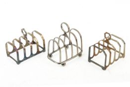 Three small Victorian and later silver toast racks.