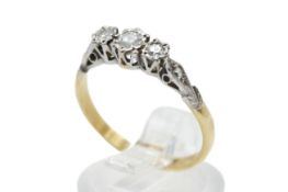 An 18ct gold three stone diamond ring.