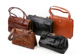 Five vintage handbags.