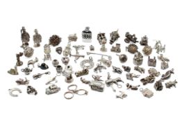 A collection of silver and white metal charms.