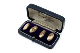 A pair of vintage yellow metal cufflinks.