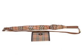 A Burberry umbrella and purse.