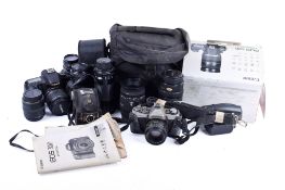Box of assorted film and digital cameras. Including a Canon EOS 60D with a EF-S 18-55mm 1:3.5-5.