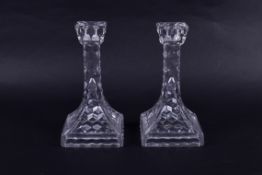A pair of Fostoria American cube glass Eiffel towel pattern candlesticks. Raised on square bases.