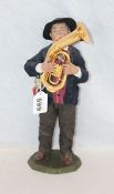 Holzskulptur 'Tubaspieler', fein geschnitzt und bekleidet, am Boden monogrammiert LH für Luis Höger,