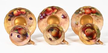 Three Royal Worcester fruit and gilt decorated tea cups and saucers, one cup and saucer painted by H