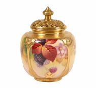 A Royal Worcester lidded pot pourri vase, decorated with autumn fruits and dog roses by Kitty Blake,