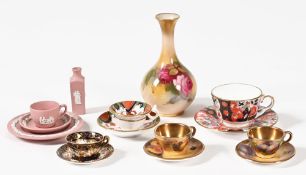 A Royal Worcester blush ivory vase, with painted roses. Height 10.5 cm, together with miniature