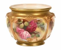 A Royal Worcester bowl, hand painted with roses in the manner of W H Austin, green printed mark to