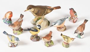 Spode Mistle Thrush. Height 13 cm, together with nine Royal Worcester birds, to include Nuthatch,