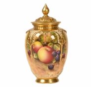 A Royal Worcester lidded pot pourri vase, decorated with fruit and signed E Townsend, puce mark to