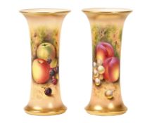 A pair of Royal Worcester spill vases, decorated with autumn fruit by E Townsend, both signed,