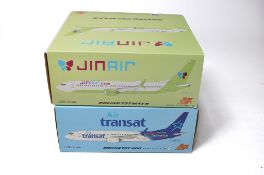 A duo of diecast model aircraft 1/200 scale issues comprising 1) FOX JINAIR Boeing 737 Max 8, 2)