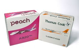 A duo of diecast model aircraft 1/200 scale issues comprising 1) FOX Peach A320neo, 2) FOX Thomas