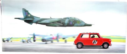 A large mounted Canvas Print depicting a Mini vs Harrier