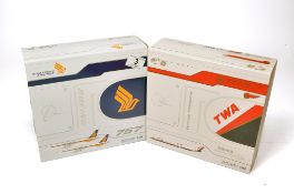 A duo of diecast model aircraft 1/200 scale issues comprising 1) JC Wings TWA McDonnell Douglas MD-