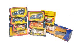 A group of Corgi boxed diecast model racing cars including a Porsche Racing Set. All look to be