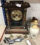 A late 19th Century faux rosewood cased (painted pine) German mantel clock with eight day movement,