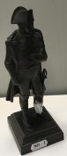 A chocolate patinated bronze figure of Napoleon Bonaparte on a stepped plinth base in the 19th