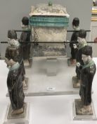 A Ming Dynasty glazed pottery funerary sedan chair group,