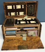 A Victorian walnut games compendium with “The Foster” whist markers by Charles Goodall & Son of