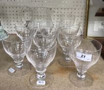 A set of nine Stuart plain ribbed glass rummers,