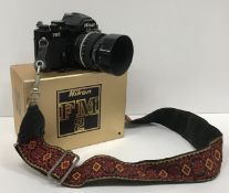 A Nikon FM2 camera with Nikkor 50mm lens