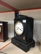 A Victorian marble cased mantel clock with eight-day movement and circular enamelled dial set with
